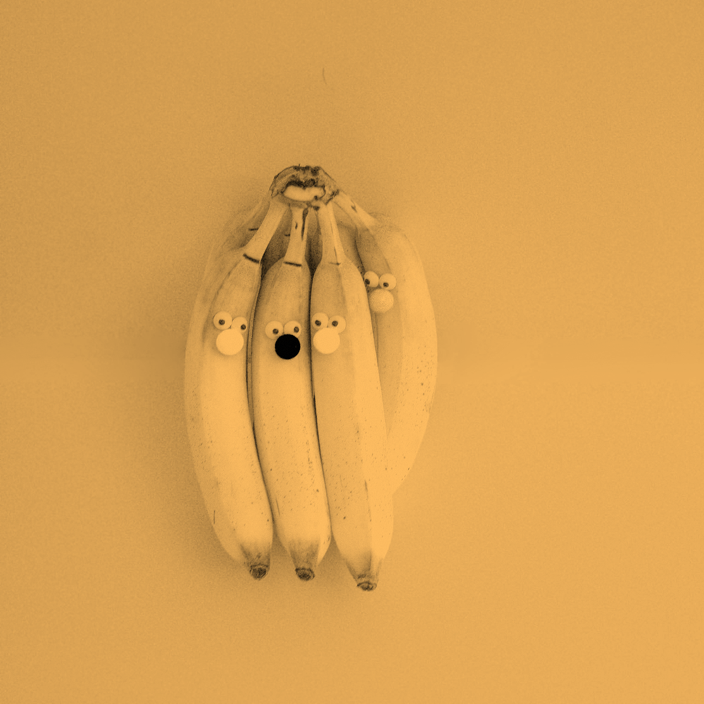  a bunch of bananas with googly eyes